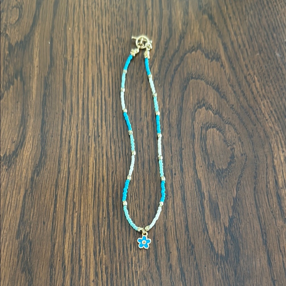 Blue and Gold Beaded Necklace with Flower Pendant
